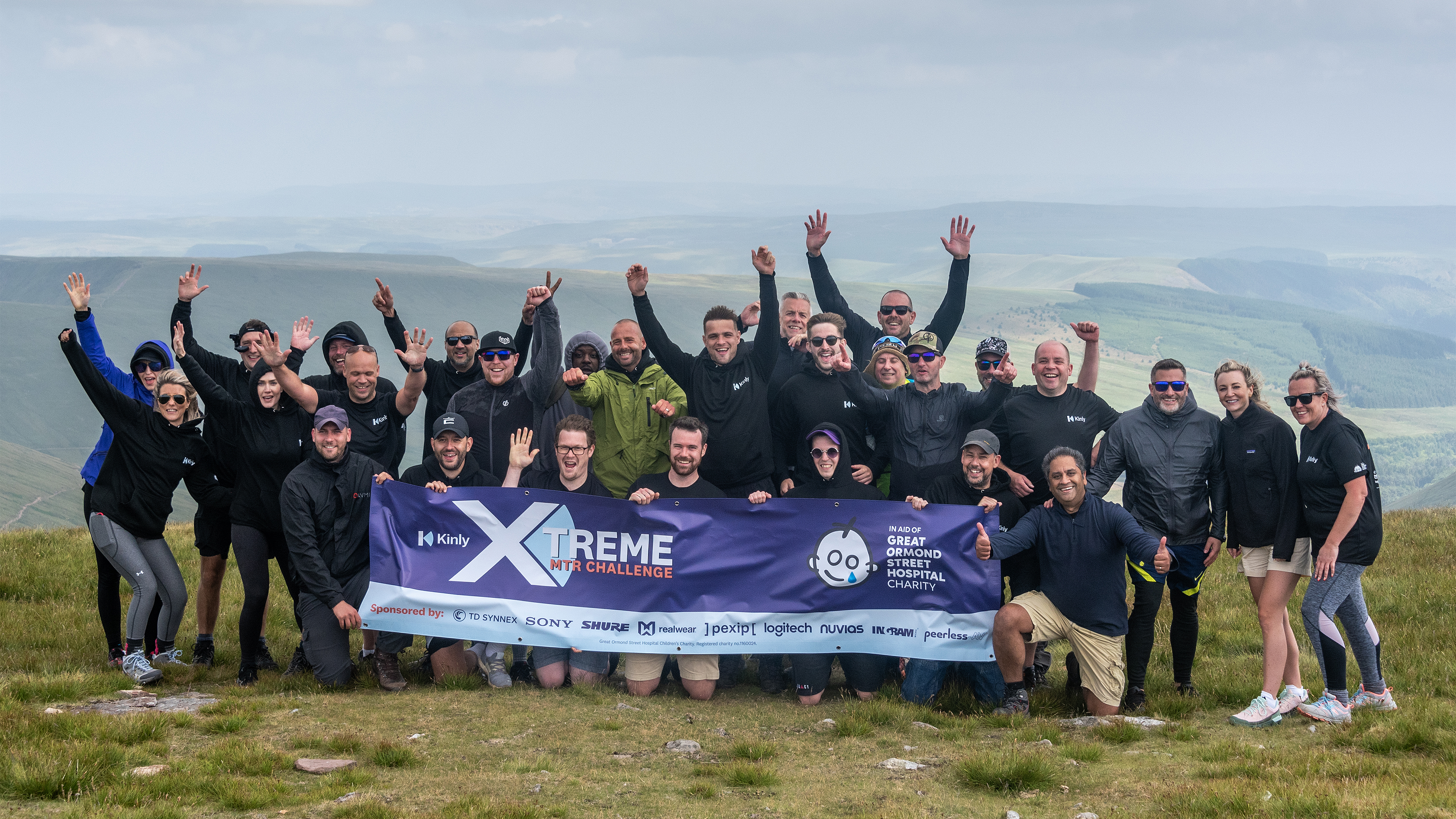 Team Kinly cheering at the top of Pen Y Fan